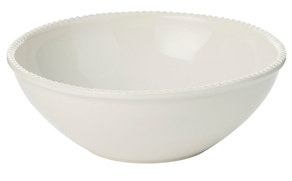 Serveringsskål Dots Ø25 cm Hvit Steingods er en hvit steingodsskål med en dekorativ bølget kant.