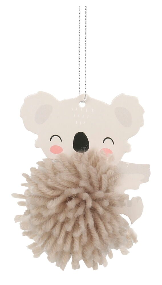Brun pompom hänger på en koala dekoration.