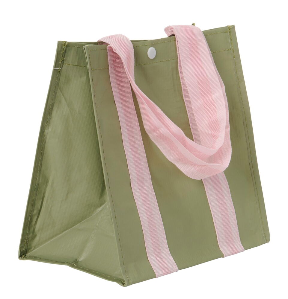 Vihreä lounaskassi, jossa on vaaleanpunainen kahva.