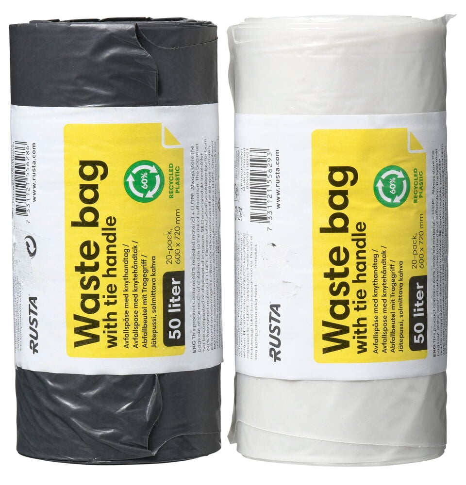 Två rullar soppåsar i svart och vitt.
