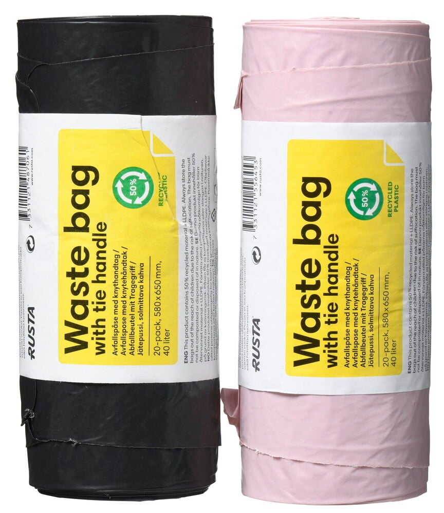 Två rullar soppåsar i svart och rosa färg.