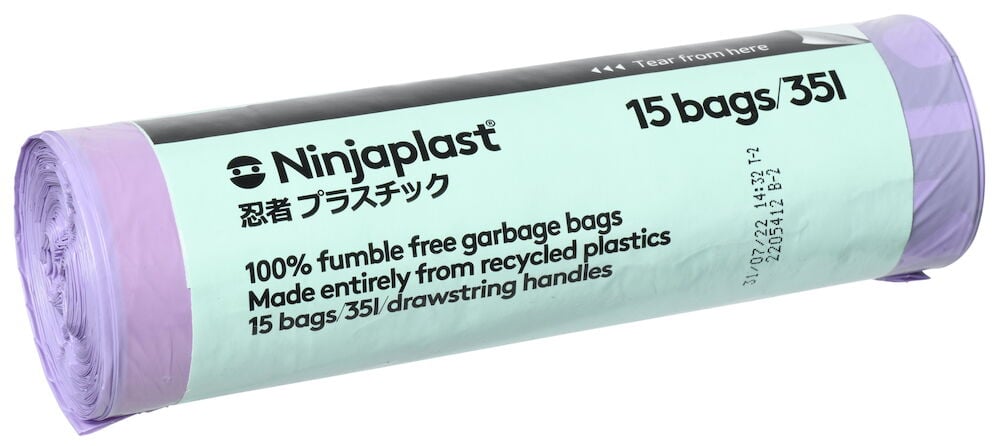 Rolle mit lilafarbenen Müllbeuteln und grünem Etikett.