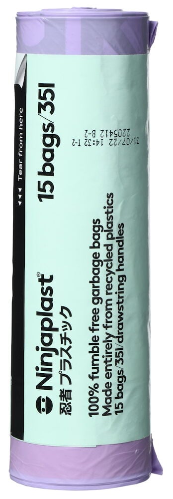 Rolle mit lila Müllbeuteln und grünem Etikett.