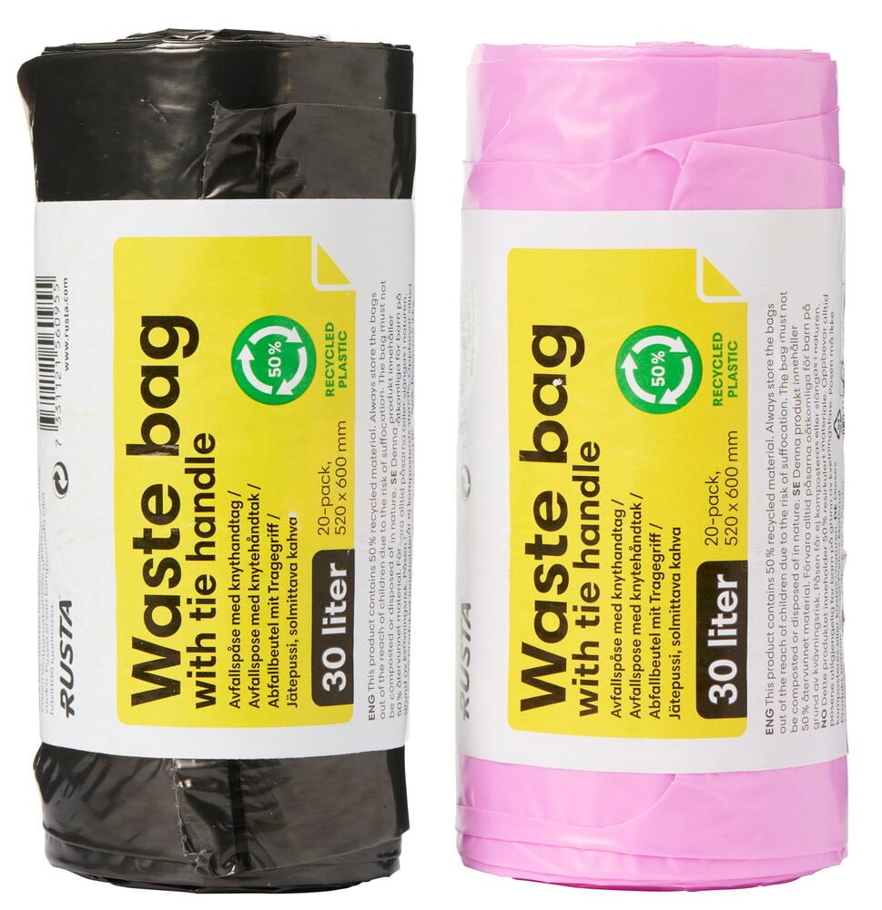 Kaksi rullaa jätepusseja eri väreissä.