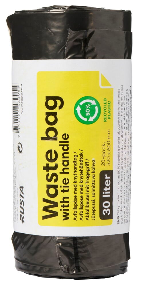 Rulla mustia jätepussia, joissa on kahvat.