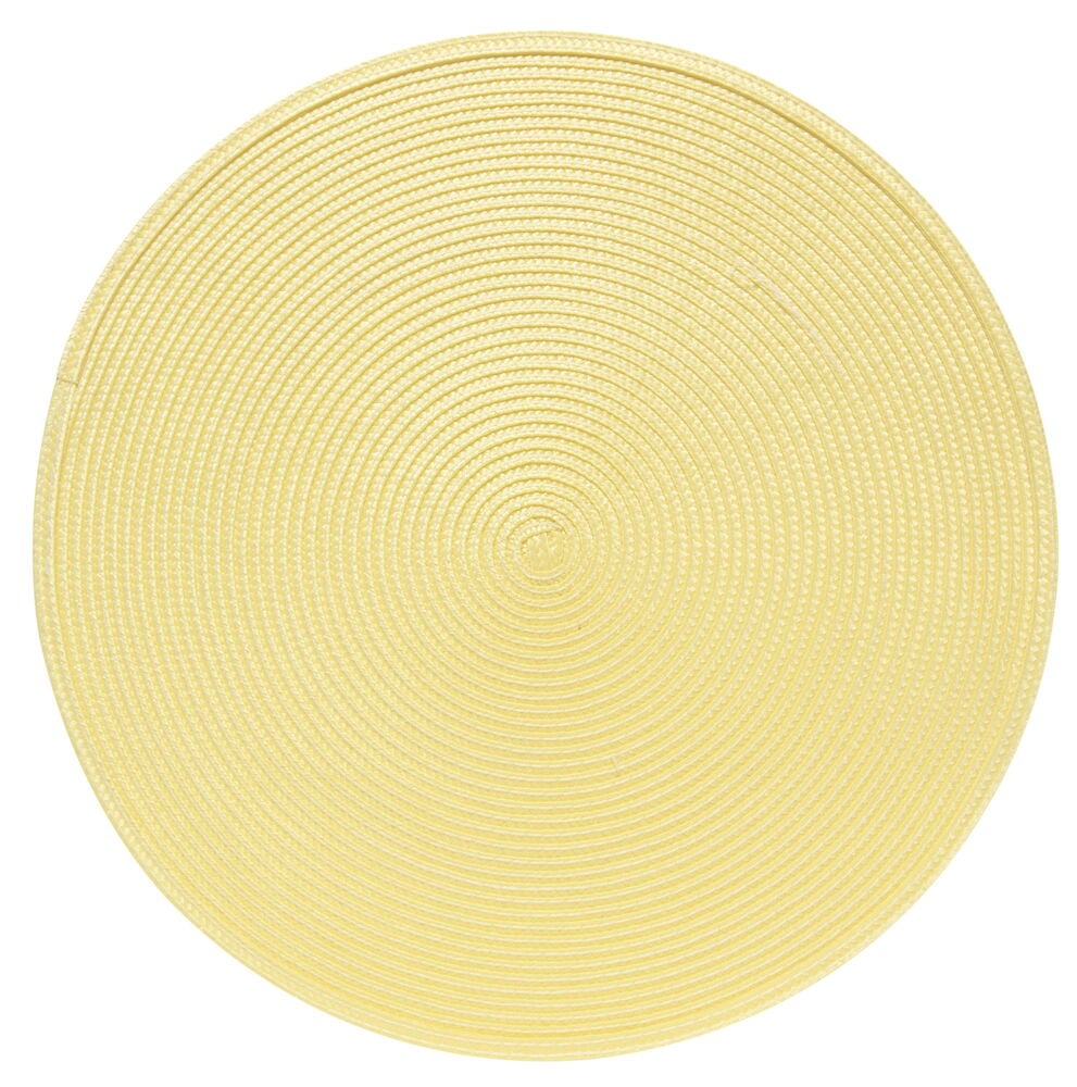 Pyöreä sinapinkeltainen tabletti punottua muovia.