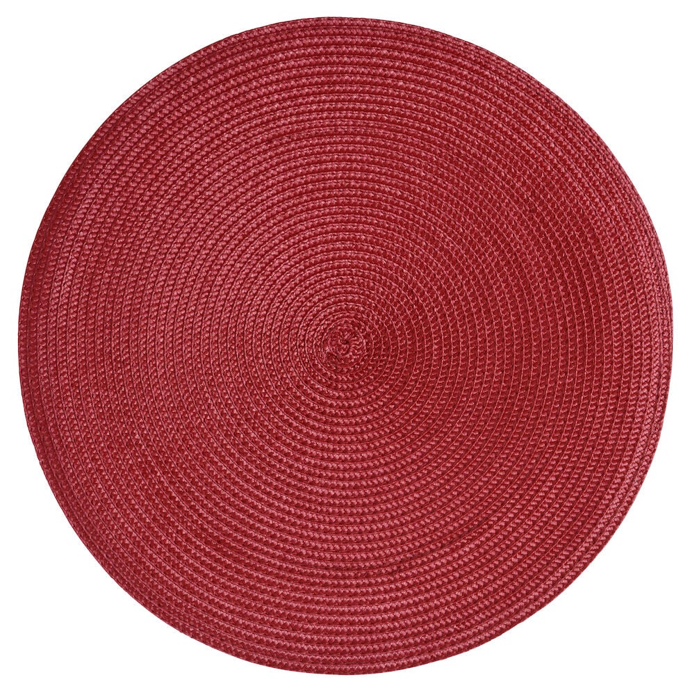Runder roter Tischset aus geflochtenem Plastik.