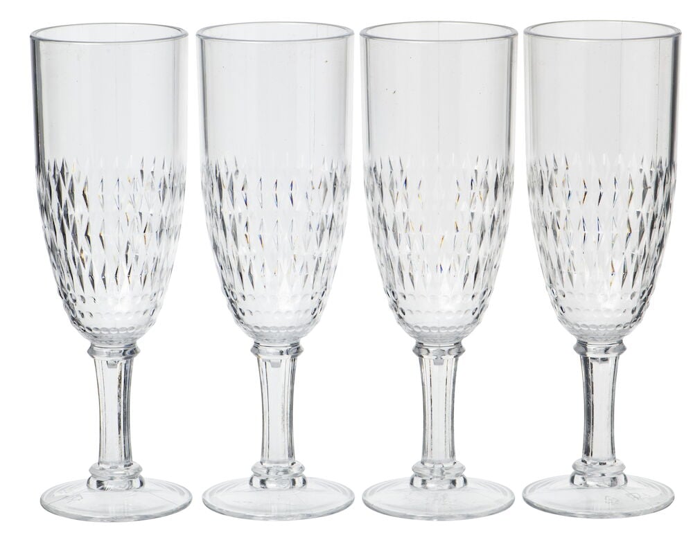 Fyra transparenta champagneglas i plast med dekorativt mönster.