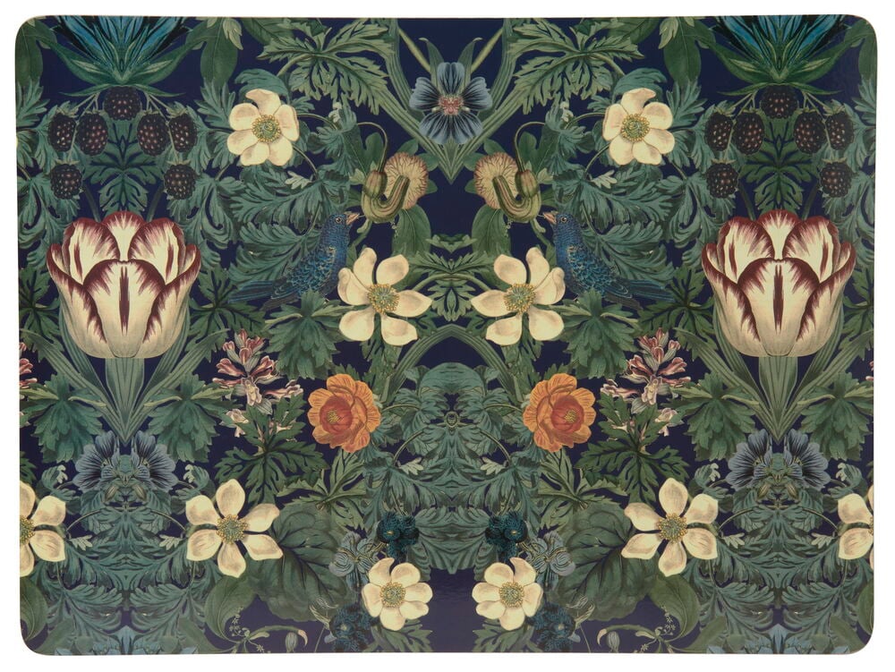 Bordbrikke med fargerikt blomstermønster på mørk bakgrunn.