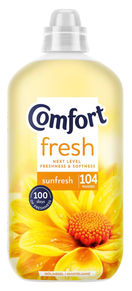 Stor plastflaska med gul etikett och blomma.