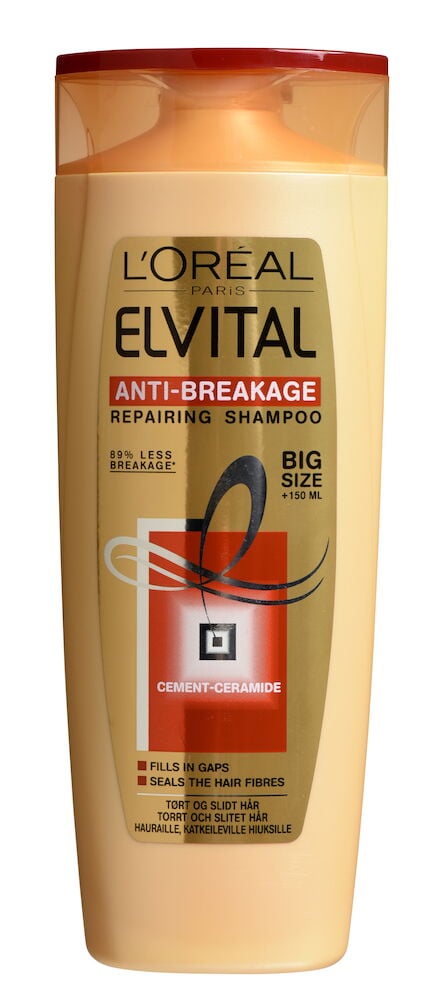 Oranssi pullo L'Oréal Elvital shampoo vaurioituneille hiuksille.