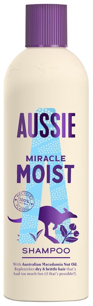 Beige pullo, jossa violetti korkki ja violetti teksti.