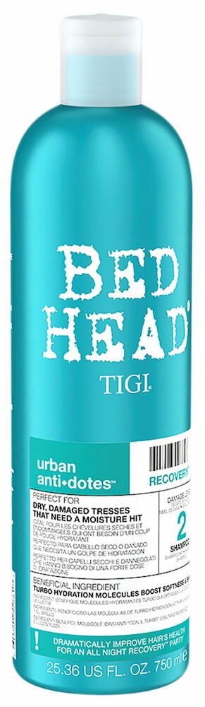 Sininen pullo Bed Head -shampoota, jossa on valkoinen korkki.