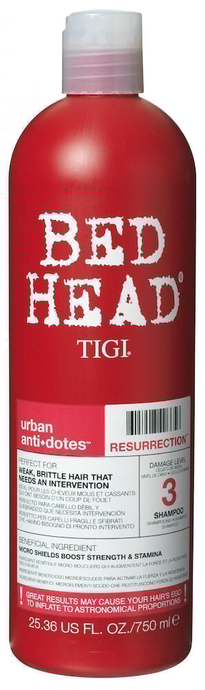 Punainen muovipullo, jossa Bed Head -logo ja teksti.