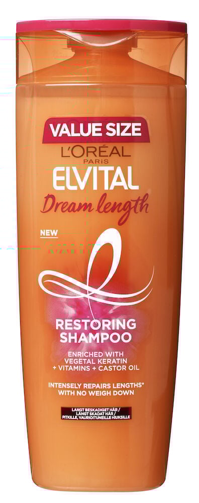 Oranssi shampoopullo, jossa vaaleanpunainen korkki ja etiketti.