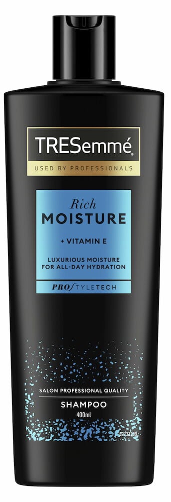 Svart schampoflaska med blå etikett och plastlock.