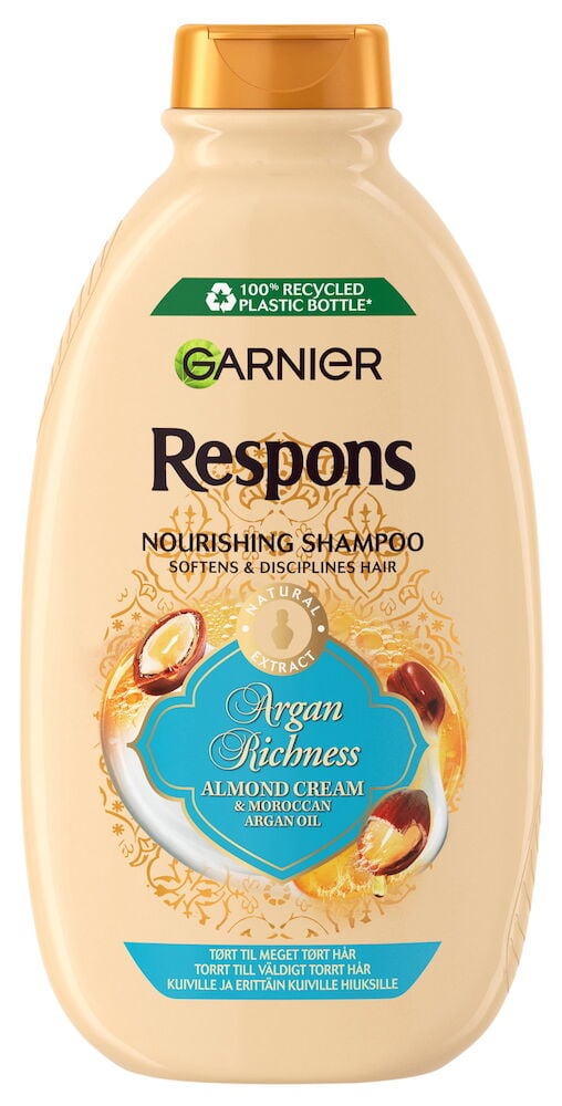 Beige schampoflaska med orange lock och blå etikett.