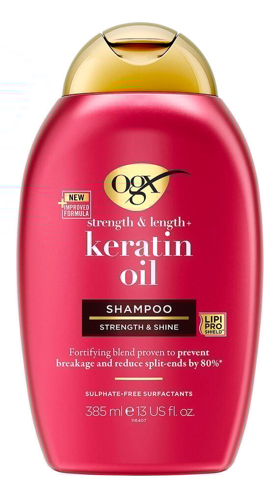 Röd schampoflaska med guldfärgat plastlock.