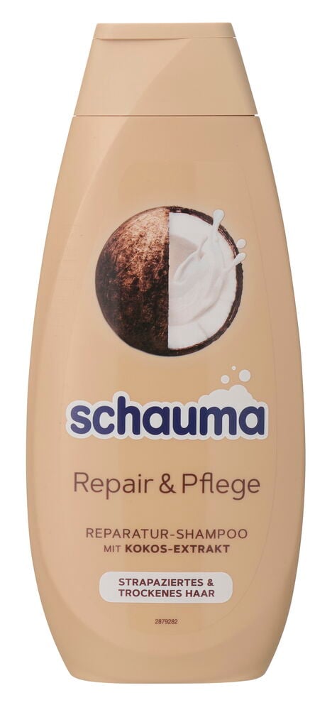 Eine beige Schauma Repair & Pflege Shampoo 400 ml Flasche mit Kokosgrafik und weißem Text.