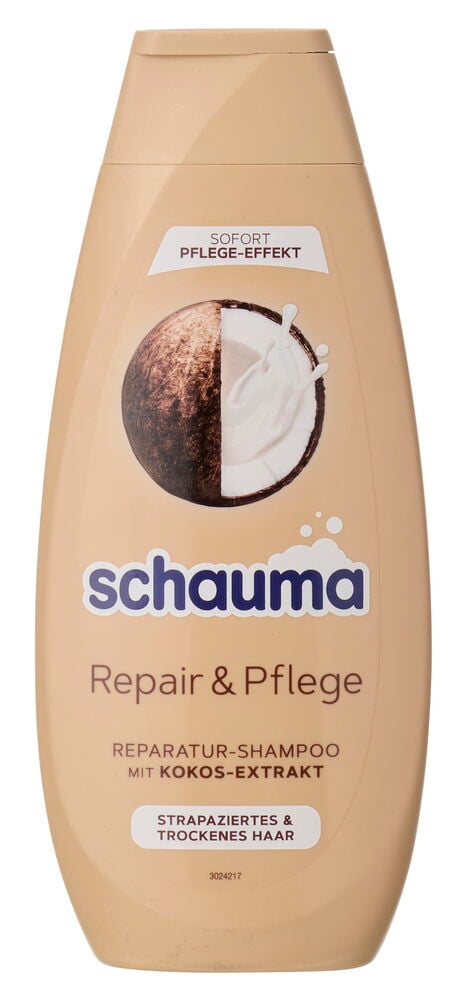Beige Schauma Repair & Pflege Shampooflasche mit Kokosnuss-Illustration und Text.