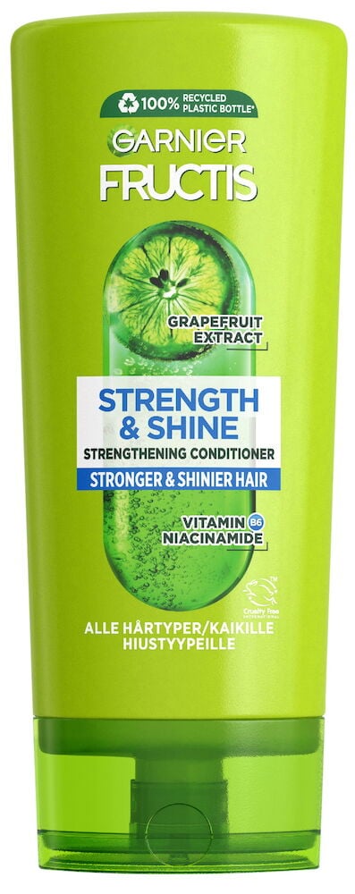 Grön balsamflaska med text och grapefruktmotiv.