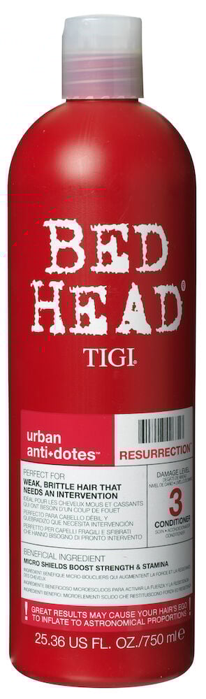 Stor röd flaska Bed Head balsam med lock.