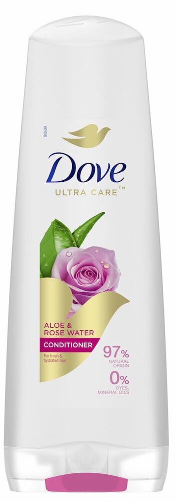 Vit flaska Dove balsam med rosmotiv på etiketten.