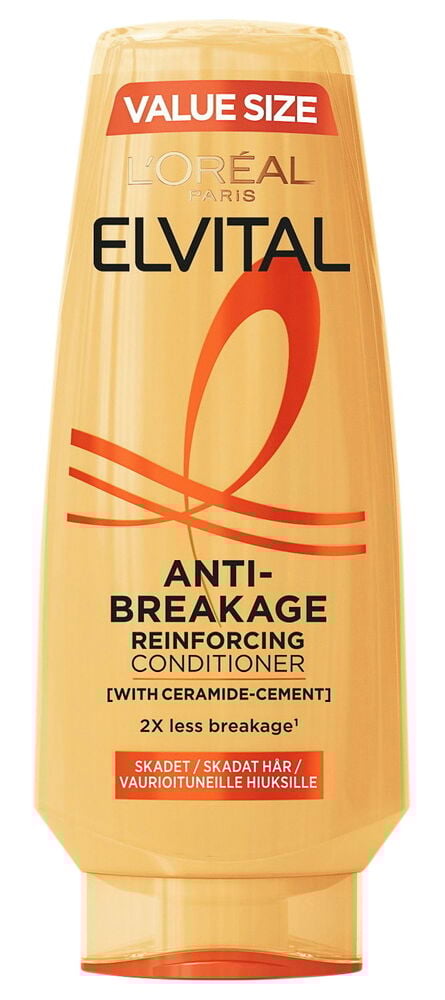 Keltainen hoitoainepullo, jossa on punainen teksti ja muovikorkki.