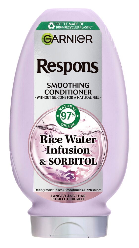 En oval, ljuslila Balsam Respons 400 ml Rice Water flaska med vitgrön etikett, frontvy.