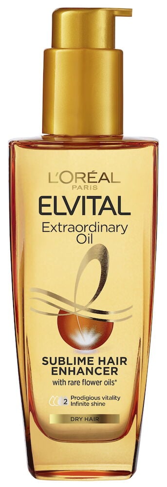 Gjennomsiktig pumpeflaske med gyllen hårolje.