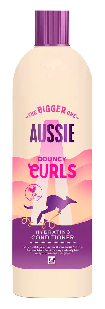 Kremfarget Aussie Bouncy Curls Hydrating Balsamflaske med lilla riflet kork og base.