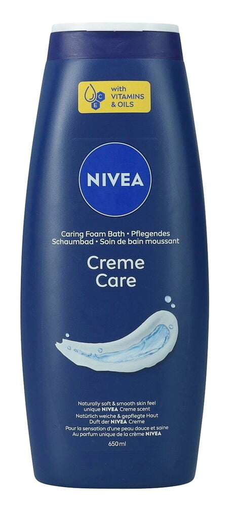 Dunkelblaue Nivea 650 ml Creme Care Duschcremeflasche mit weißem Verschluss, verziert mit Creme- und Vitaminillustrationen.
