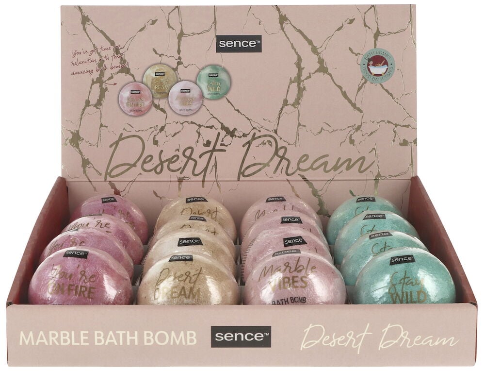 Useita värikkäitä kylpypalloja avoimessa pahvipakkauksessa.