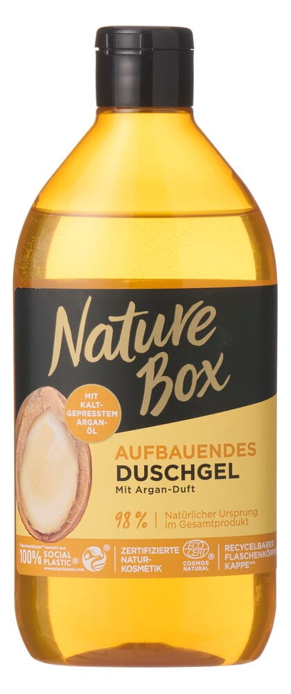 Eine transparente bernsteinfarbene Flasche Nature Box Duschgel Argan Oil mit schwarzem Verschluss.