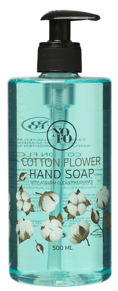 Turkoosi pumppupullo, jossa käsisaippuaa ja puuvillankukkia.