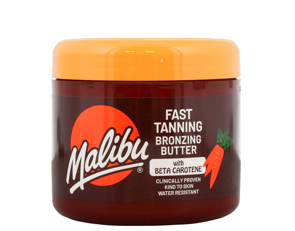 Ruskea purkki, jossa on oranssi kansi ja etiketti.