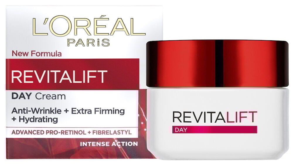 Vit burk med rött lock bredvid kartongförpackning.