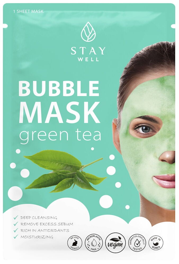 Grüne Tuchmaske für die Gesichtsreinigung mit Blasen.