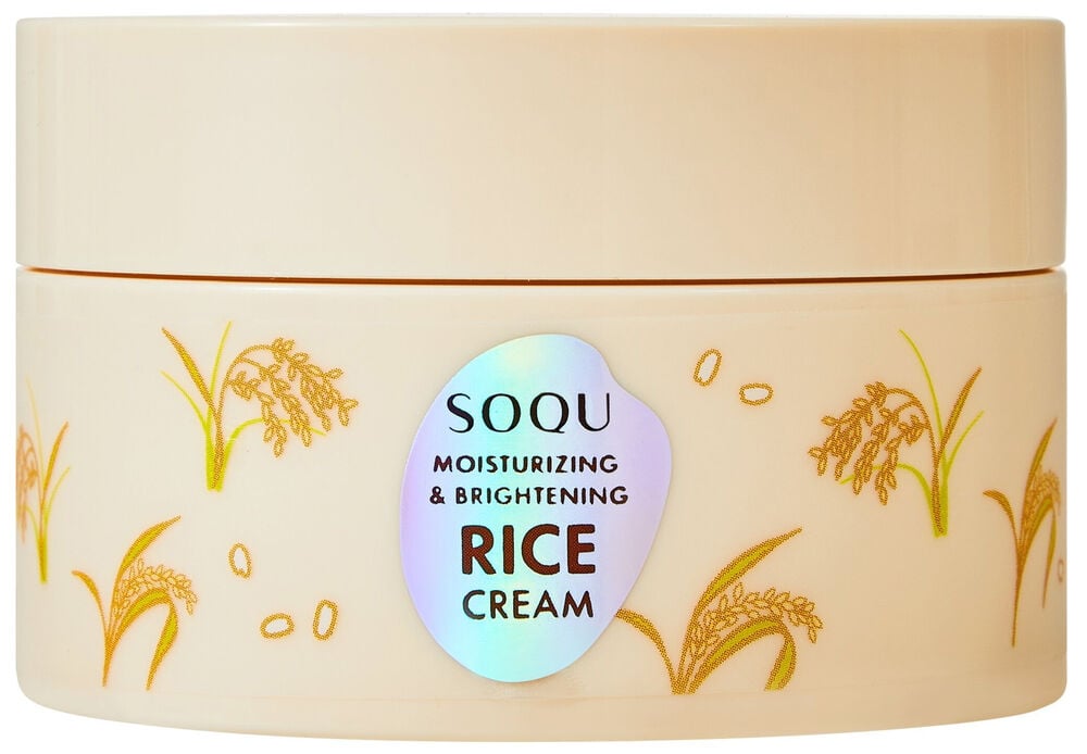 En beige SOQU 70 ml Rice ansiktskrämburk med gyllene risväxtillustrationer och en holografisk etikett.