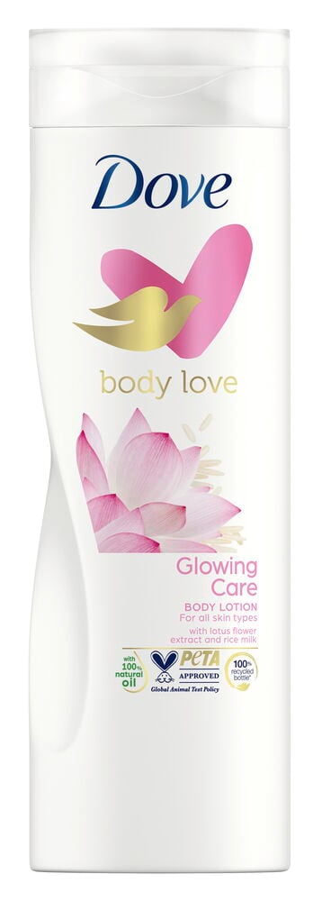 Hvit flaske Dove bodylotion med rosa lotusblomst.