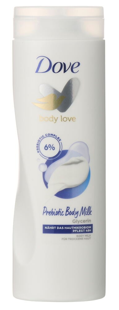Weiße Dove Prebiotic Body Milk Flasche mit transparentem Deckel und zwei Taubensymbolen, zeigt ein „6% Prebiotic Complex“-Etikett.