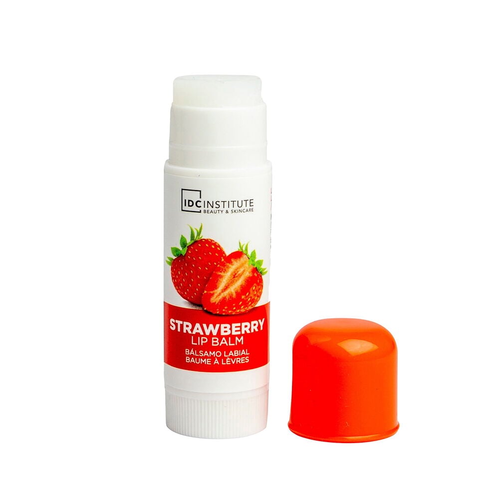 Jordbærleppebalsam i hvit tube med fjernet oransje kork, viser den hvite balsamen.