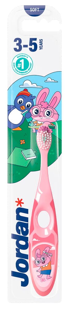 Eine rosa Jordan Kinderzahnbürste mit mehrfarbigen Borsten in weißer Verpackung mit Comicfiguren.