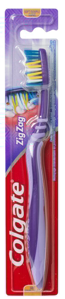 Lila Colgate tandborste i förpackning med mjuka borst.