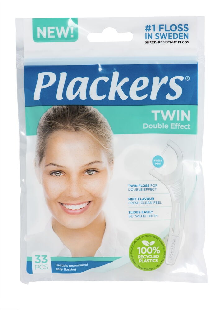 Förpackning med tandtrådsbyglar och leende kvinna.