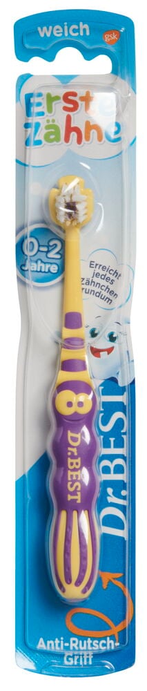 Dr. Best weiche Zahnbürste für 0-2-Jährige, mit gelbem Kopf und lila/gelbem Anti-Rutsch-Griff.