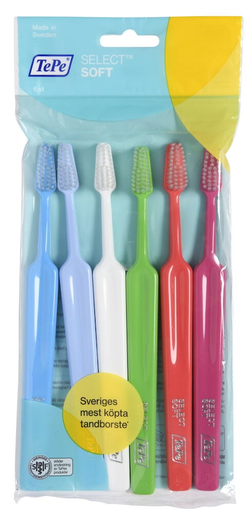Sex färgglada mjuka tandborstar i genomskinlig plastförpackning.