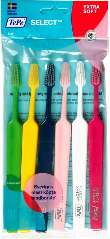 Sex färgglada tandborstar i plastförpackning.