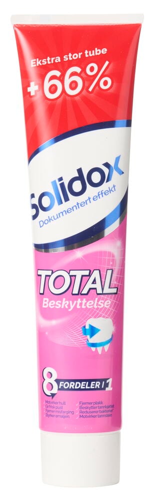 Rød og hvit tube tannkrem med hvit kork.