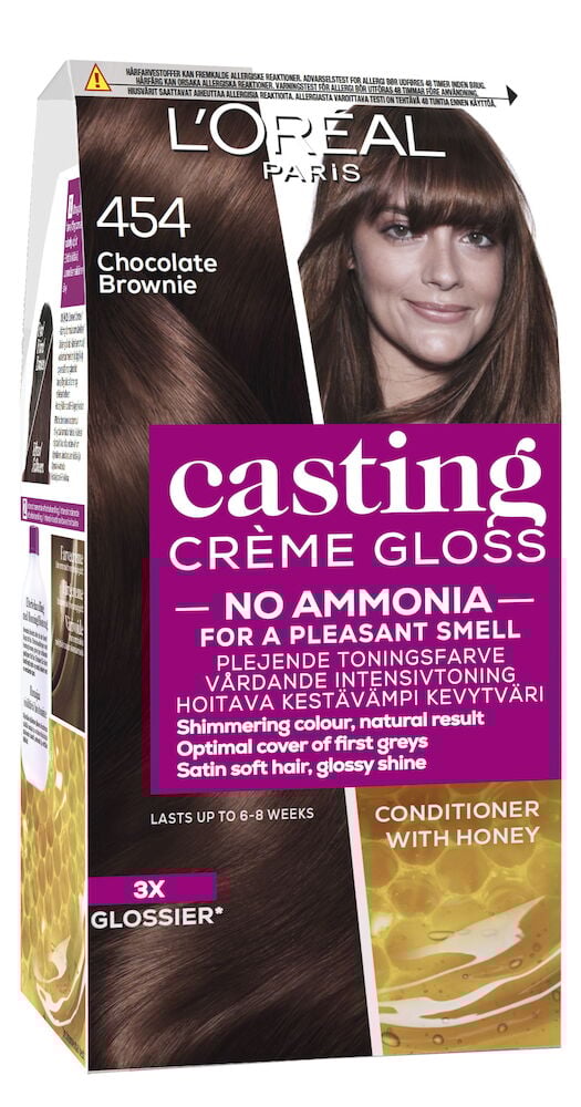 Kartong med hårfärg, brun nyans och leende kvinna.